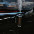 Two CALVIRO Air smart car fragrance diffusers